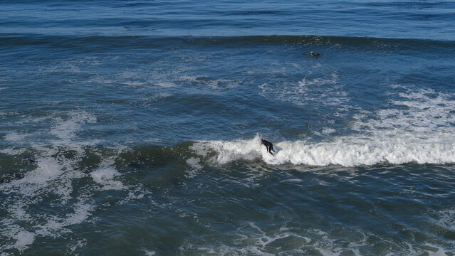 Surfer Surfin On The Top Of The Wave, California