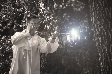 Man wizard with magic wand. Halloween concept, masquerade or cosplay Medieval look