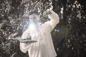 Man wizard with magic wand. Halloween concept, masquerade or cosplay Medieval look
