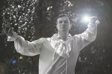 Man wizard with magic wand. Halloween concept, masquerade or cosplay Medieval look