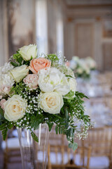 hall of an ancient castle with catering for catering and wedding events. Detail of floral bouquet on table