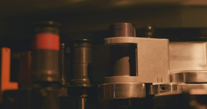 Internal mechanisms in a cinema projector in a movie theatre
