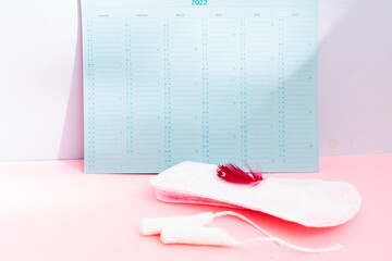 Menstrual pad with schedule card background