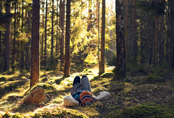 Person relaxing and resting in the forest
