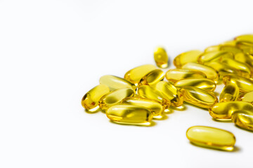 Vitamins in capsules fish oil, omega 3 and vitamin D on a white background.