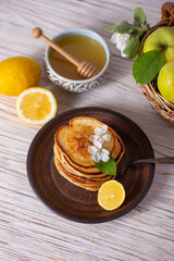 Pancakes with honey, lemon and apple