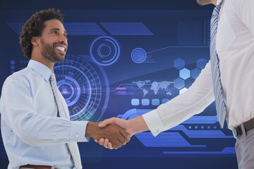 Two diverse businessmen shaking hands against digital interface with data processing