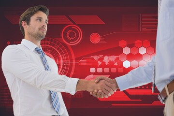 Two diverse businessmen shaking hands against digital interface with data processing