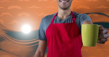 Male waiter holding a coffee cup against digital waves on orange background with copy space