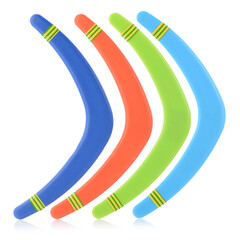 A set of colorful plastic boomerangs and frisbees for outdoor play. Children's active games. Boomerang isolated on a white background, close-up - obrazy, fototapety, plakaty