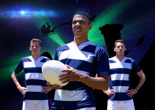 Team of diverse male rugby players against green spot of light on blue background