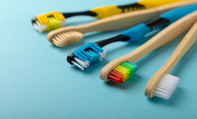 Oral care. Toothbrushes on a blue background. The concept of cosmetic products for the bathroom. Flat lay, top view, copy space. Oral care products set. Dental hygiene