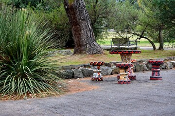 bench in a square with strong colors, flower park with a path of folders, uruguay, Montevideo