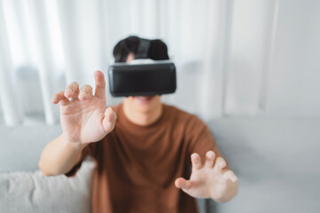 Asian man using VR headset in glasses of virtual reality technology VR experience Future technology