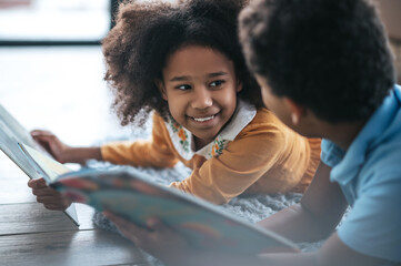 Two kids spending time together and reading