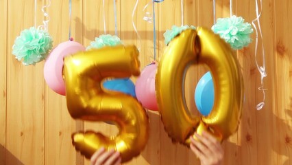 Happy fiftieth birthday with golden number fifty 50 air balloons - Powered by Adobe