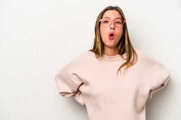Young caucasian pregnant woman isolated on white background being shocked because of something she has seen.
