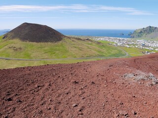 Panoramic view of Heimaey and Eldheimar seen from Eldfell volcano.