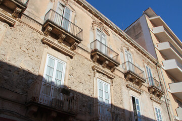 old and modern flat buildings in syracusa in sicily (italy)