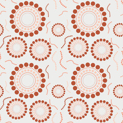 Circle dot seamless pattern coral terra cotta, peach and beige colors with dotted squizzles.  The circles look like flowers in this background.