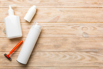shaving man set. shaving machine, towel, lotion and shaving foam on colored background. Men bath...