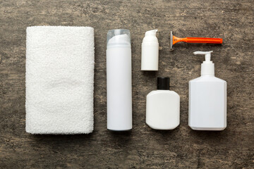 shaving man set. shaving machine, towel, lotion and shaving foam on colored background. Men bath Accessories top view