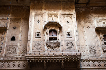 Finely carved windows of Havali(Mansions) in Jaisalmer fort of Rajasthan, India.