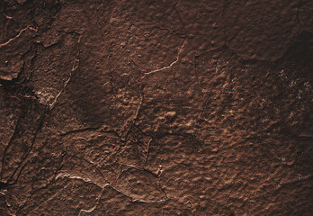 Brown wall texture. Stone background. Rock texture. Grunge Rough structure. Abstract texture. Rock surface with cracks. Rock pile. Paint spots.