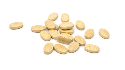 Brown pills, medicine isolated on white background, top view