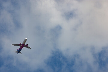 Commercial airplane in the sky and cloud flying over