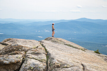 Hiker looking at mountains in New Hampshire 