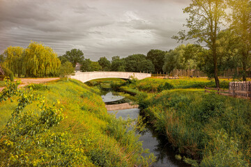 Naklejka premium Village canal and bridge in Holland