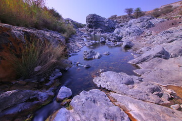 the place is beautiful , with mountains, rocks , small fish