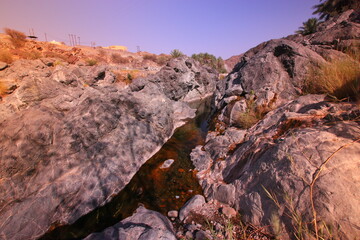the place is beautiful , with mountains, rocks , small fish