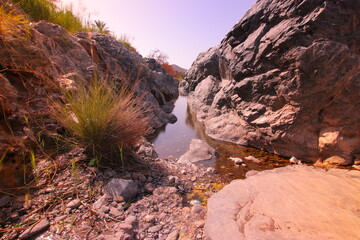the place is beautiful , with mountains, rocks , small fish