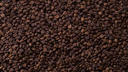 Roasted coffee beans background. Top view of panoramic coffee beans.
