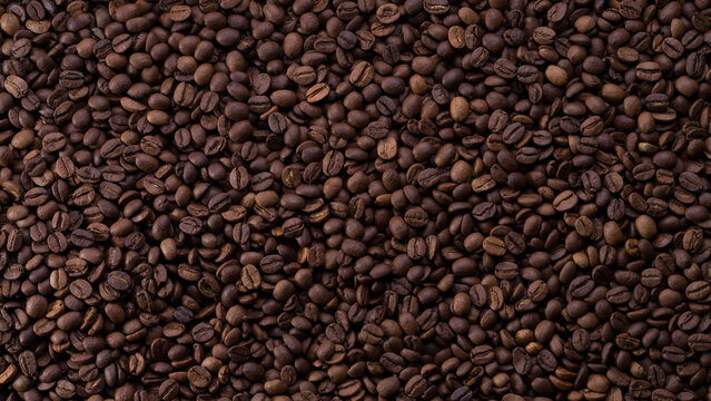 Roasted coffee beans background. Top view of panoramic coffee beans.