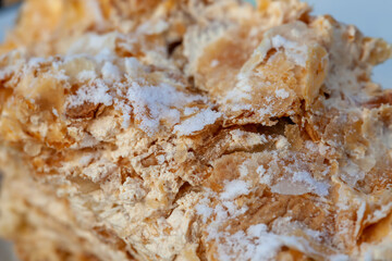 details of cake made of cakes and white buttercream close-up