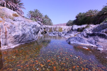 the place is beautiful , with mountains, rocks , small fish