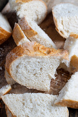 sliced loaf of bread on a cutting wooden board