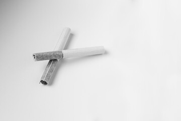 Two old cigarettes on the table