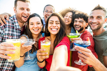 Multicultural group of friends making cocktail party outside - Happy young people taking selfie at...