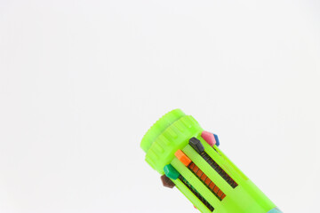 Multicolored pen with an option to choose different color ink held in the hand
