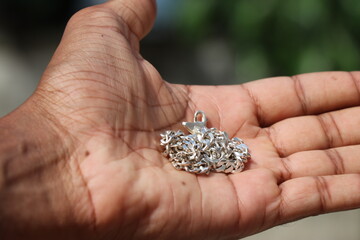 Silver chain or silver necklace is a fashion accessory held in the hand