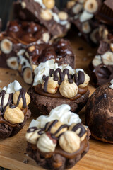 multicomponent cake made of caramel and nuts in chocolate