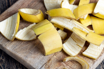 the yellow peel that was left after the bananas on the board