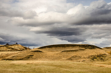 One of the pseudocraters at Skutustadir  in the Myvatn area in Iceland, with several human figures as scale reference