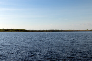glare from sunlight on the surface of the lake water