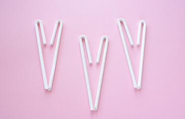 Cocktail Straws Day. Paper drinking straws on a pink background. Summer cocktail party, a fun and cheerful holiday concept