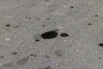 a highway with oil stains on the surface